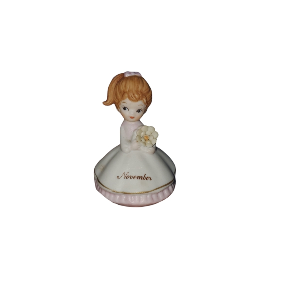 Vintage November birthday girl figurine